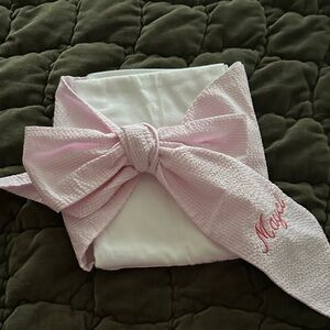 NWOT Bow Swaddle with Mayci embroidered on the ribbon of the bow Pink and White